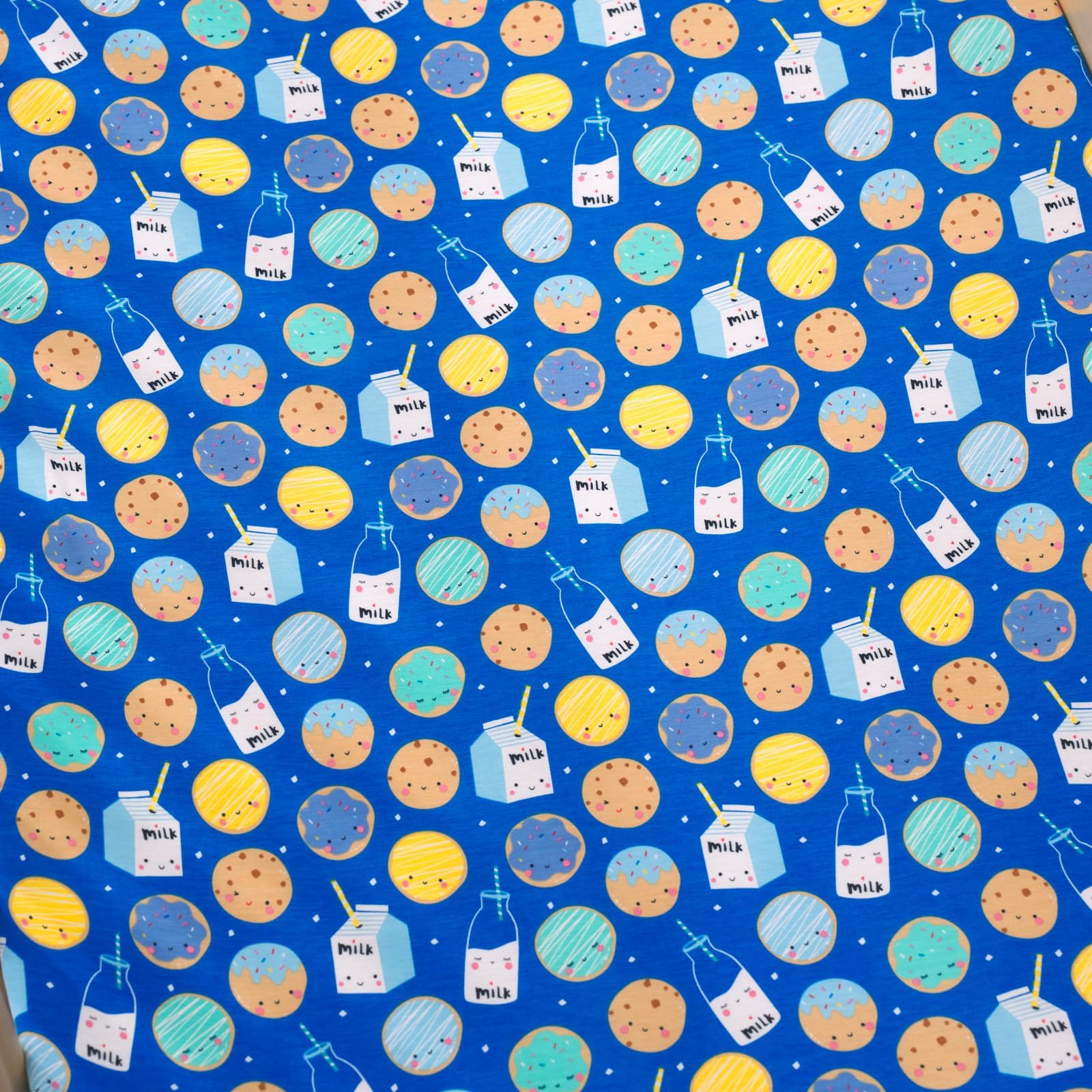 Little Sleepies blue Cookies & Milk crib sheet in a calm nursery setting.