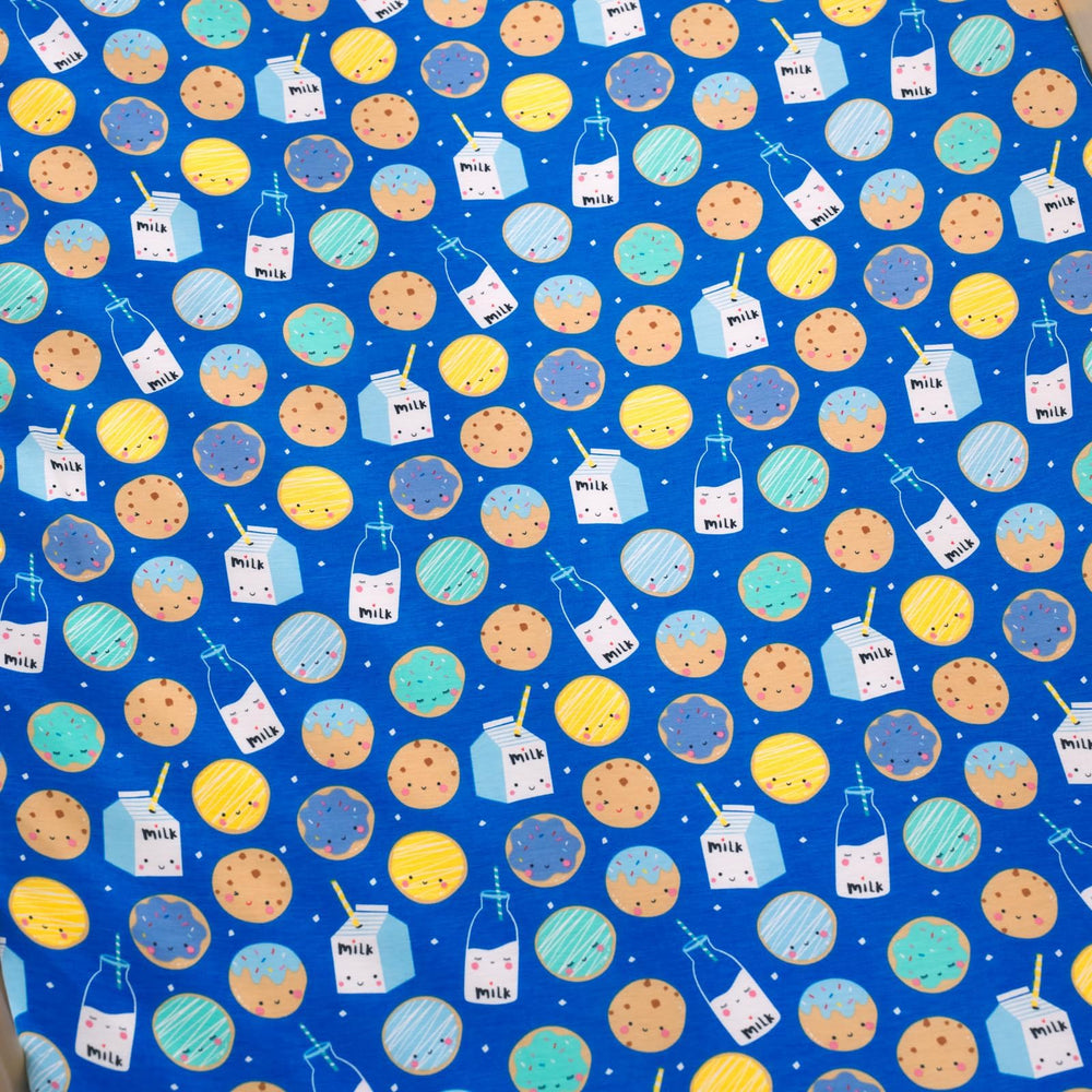 Little Sleepies blue Cookies & Milk crib sheet in a calm nursery setting.