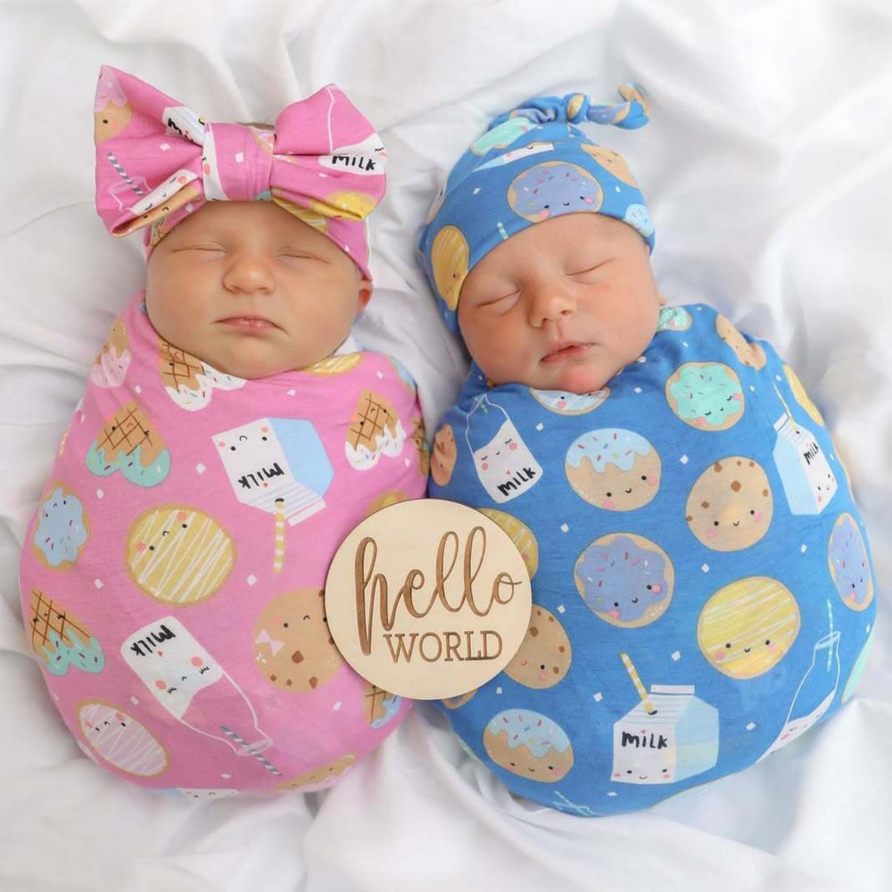 Little Sleepies swaddle used as stroller shade during outings.