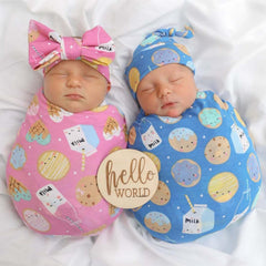 Little Sleepies swaddle used as stroller shade during outings.