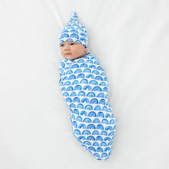 Blue rainbows swaddle serves as a cozy stroller shade.