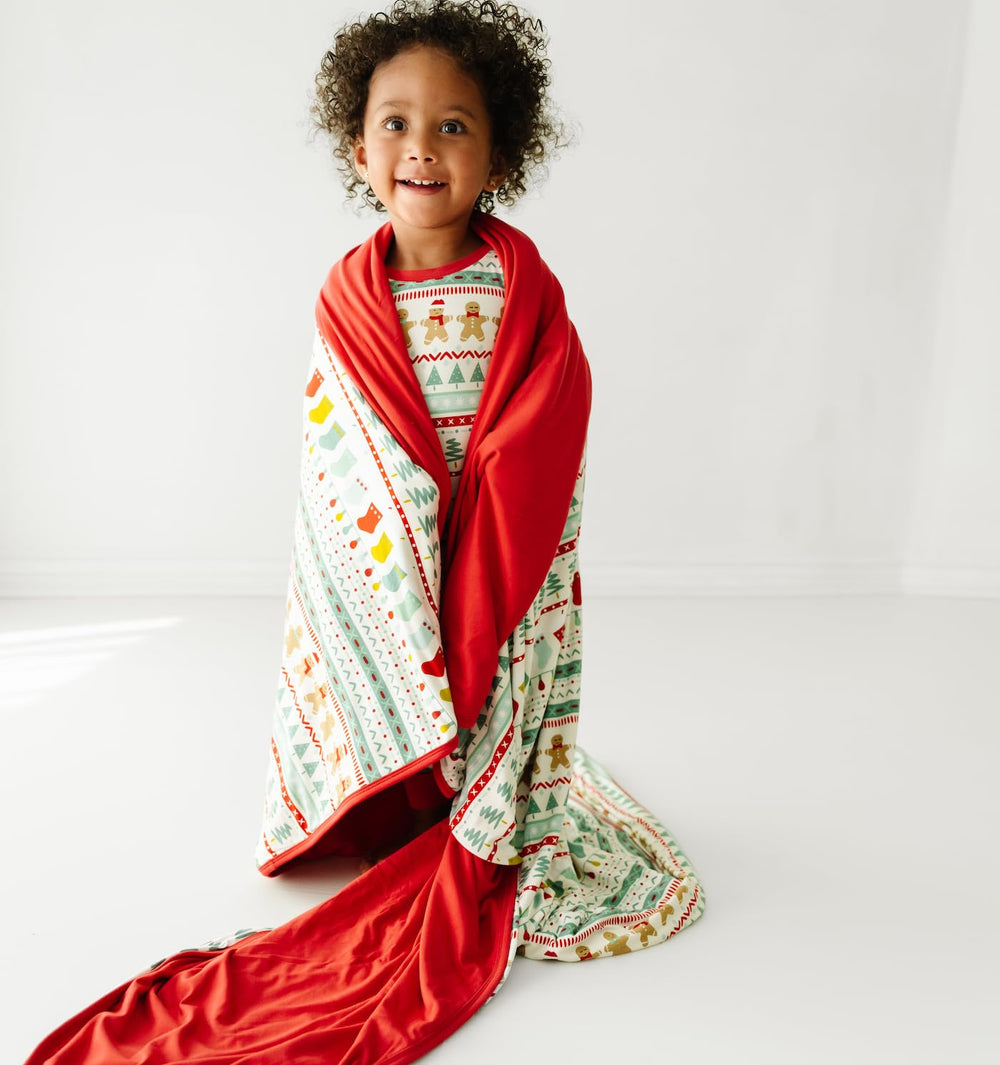 Little Sleepies Christmas blanket ideal for movie nights and couch cuddles.