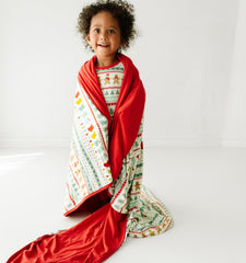 Little Sleepies Christmas blanket ideal for movie nights and couch cuddles.