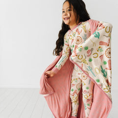 Little Sleepies Cloud Blanket multipurpose use supports travel, movie nights, and cuddles.