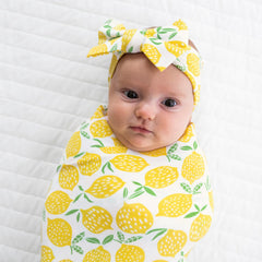 Little Sleepies lemons swaddle shines at hospital homecoming photos