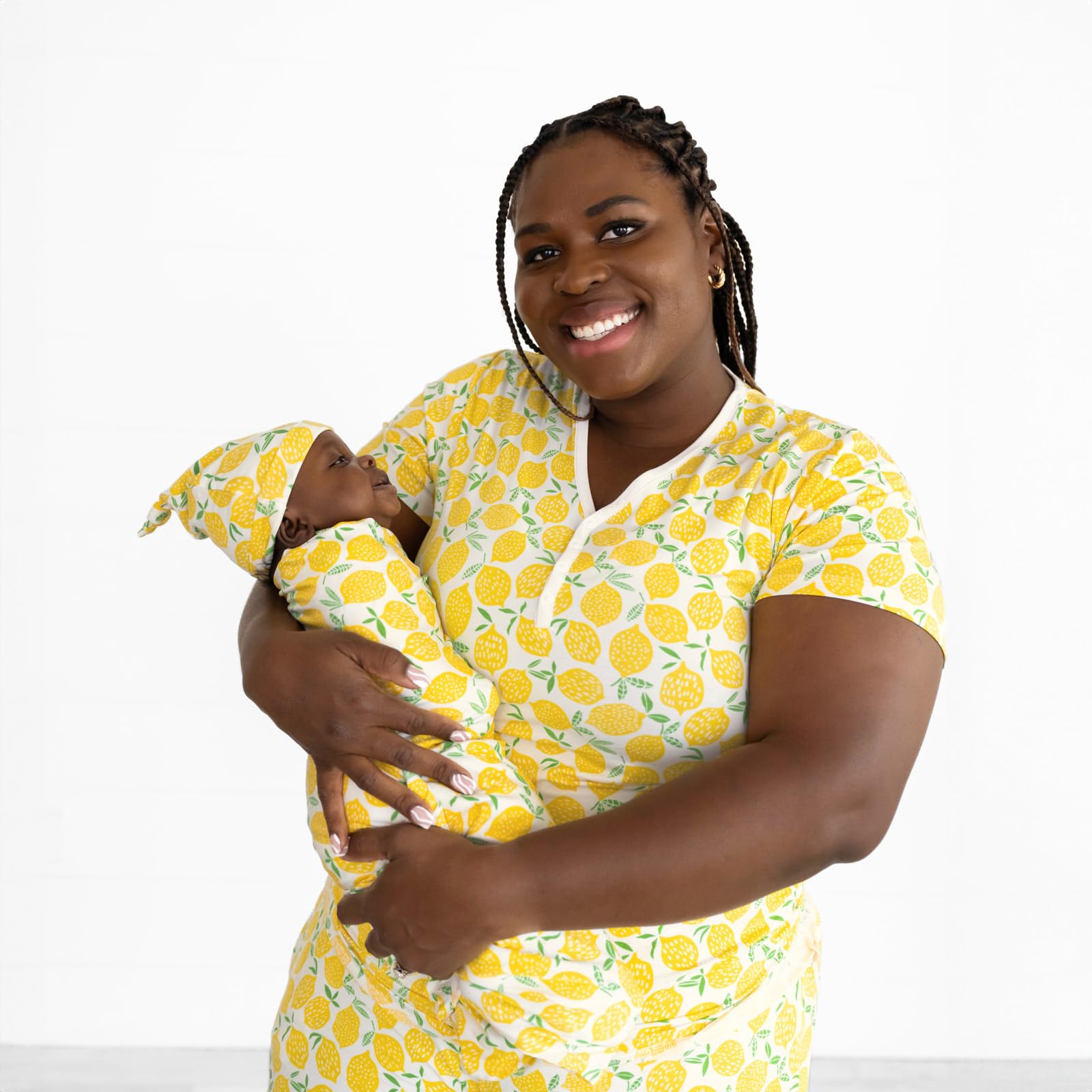 Little Sleepies Lemons swaddle set in newborn photos, soft texture shines.