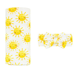 Little Sleepies Lunaluxe Sunshine swaddle blanket for newborn comfort.