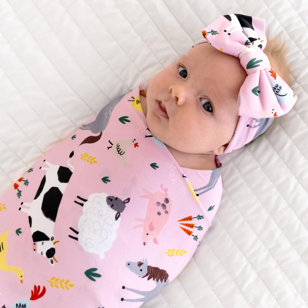 Swaddle used as stroller shade for sunny days with Little Sleepies Lunaluxe.
