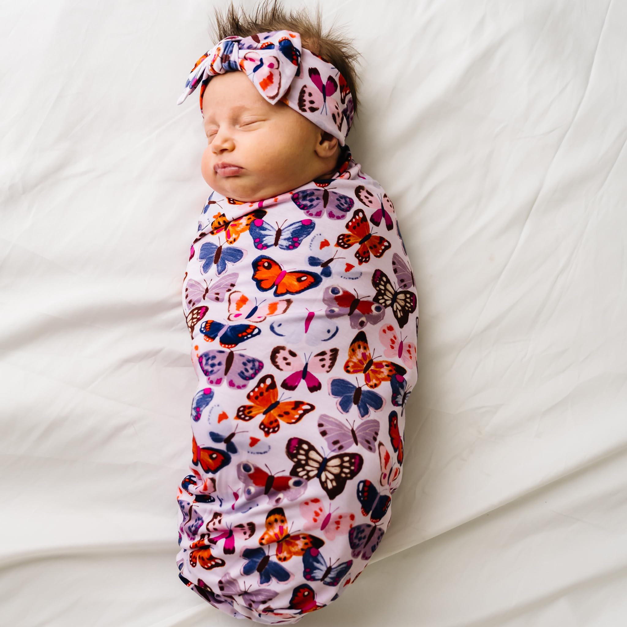 Adjustable tie-front on Little Sleepies Luxe Bow Headband demonstrates growth with child
