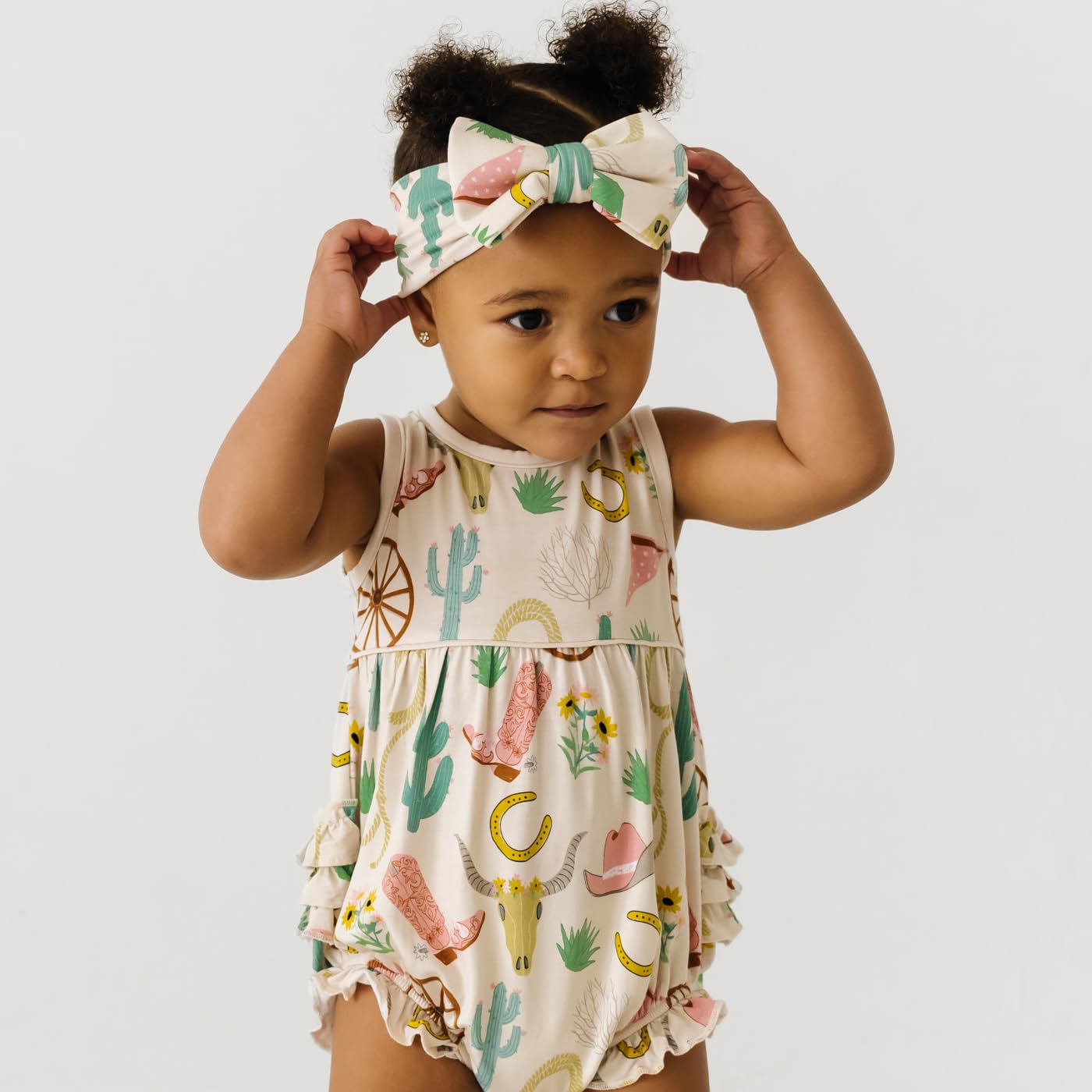 Little Sleepies Luxe Bow Headband Ready to Rodeo pairs with prints for cute, versatile looks.