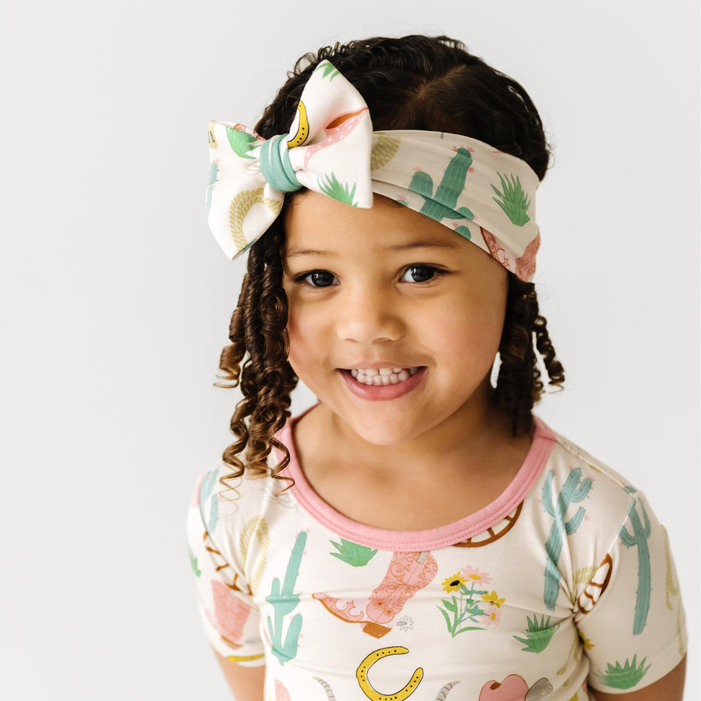 Little Sleepies Luxe Bow Headband safe and comfortable option for active kids on the go.