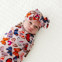 Baby wearing Little Sleepies Luxe Bow Headband for stylish everyday look
