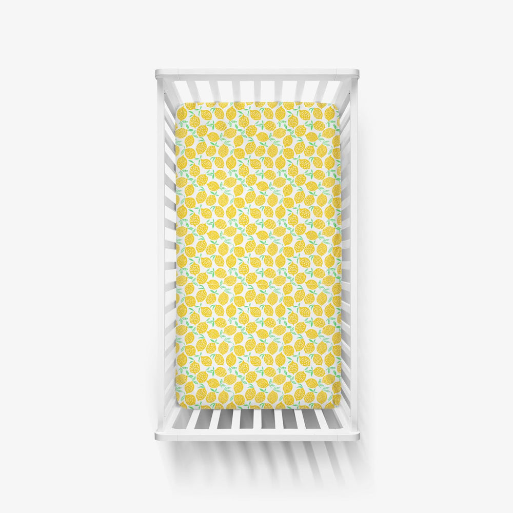 Little Sleepies matching-prints Lemon crib sheet showcases cute designs for nursery coordination.