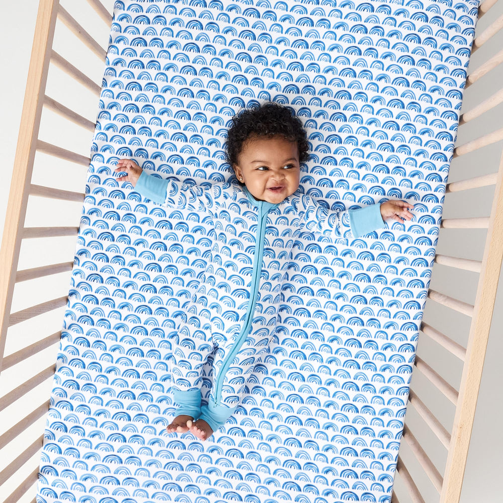 Nursery setup featuring Little Sleepies sheets for a cozy, peaceful atmosphere.