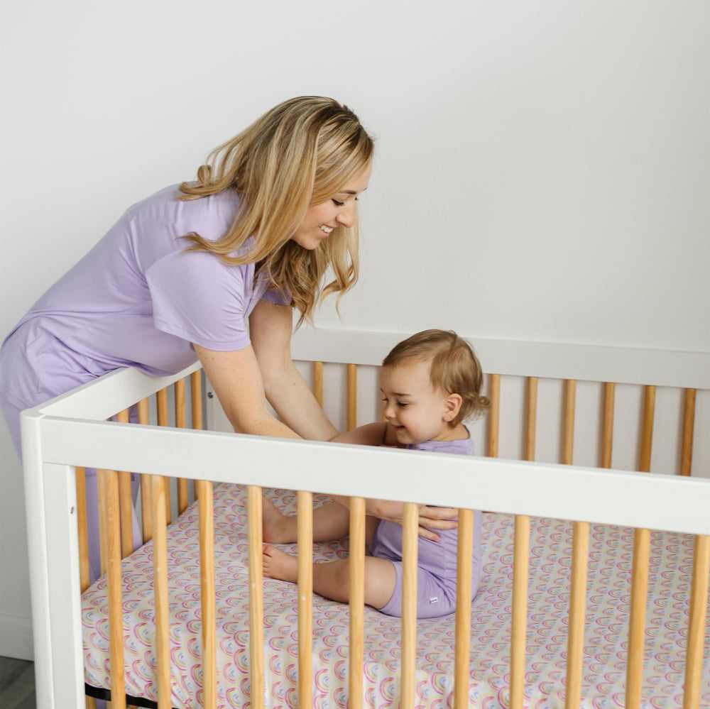 Little Sleepies pastel rainbow design enhances nursery ambiance