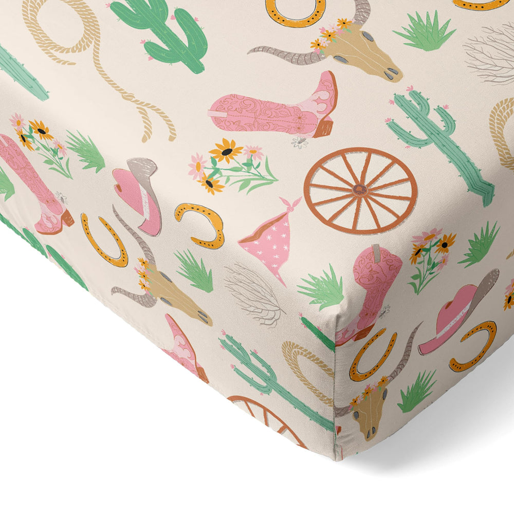 Little Sleepies pink Ready to Rodeo crib sheet with secure stretchy fit.