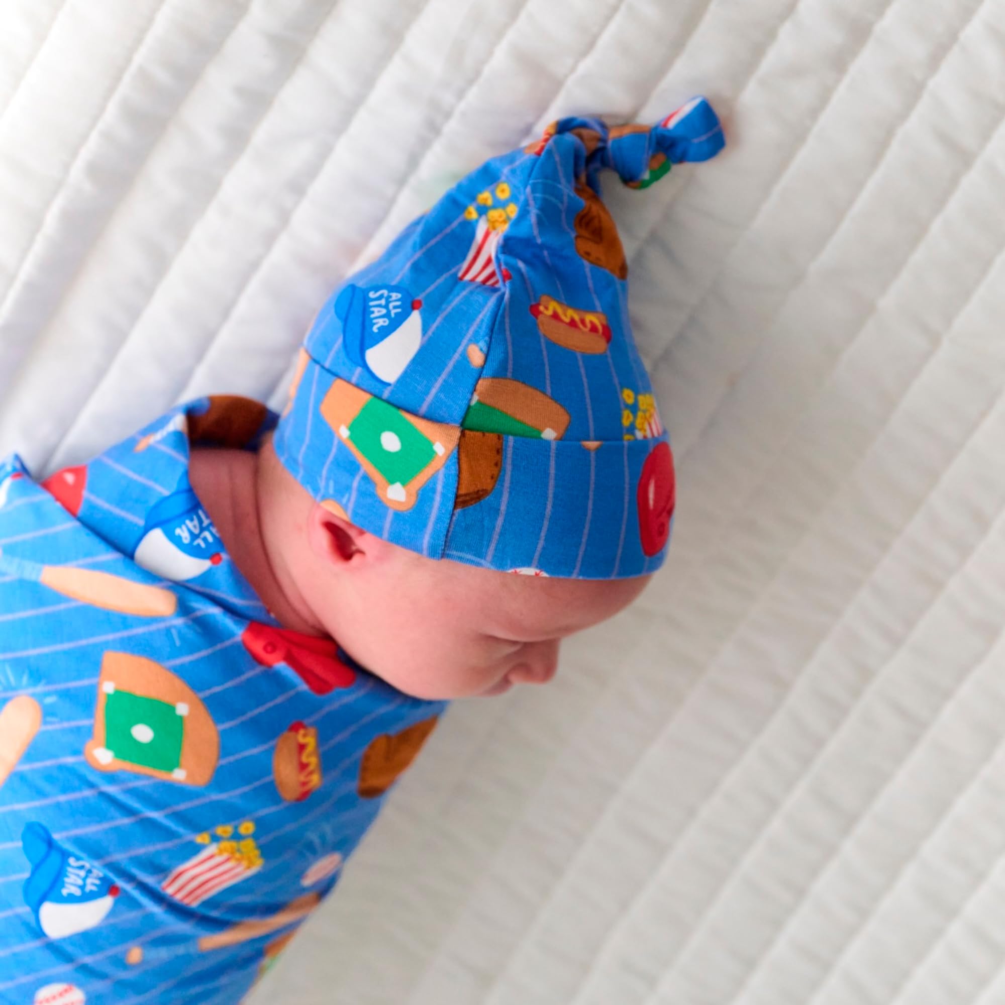 Swaddle set used as stroller shade for sunny outings.