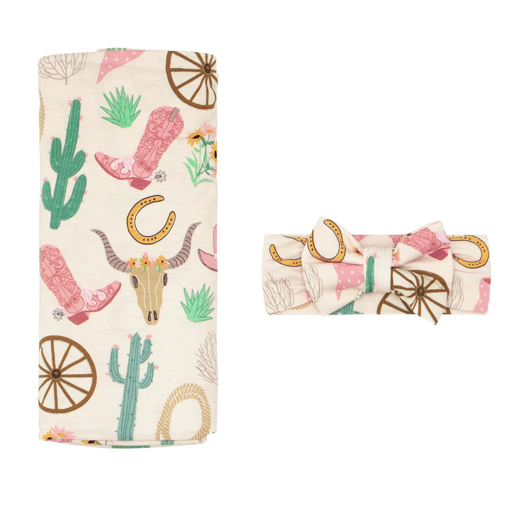 Little Sleepies swaddle 44x44 in Pink Ready to Rodeo offers gentle, breathable snugness for newborns.
