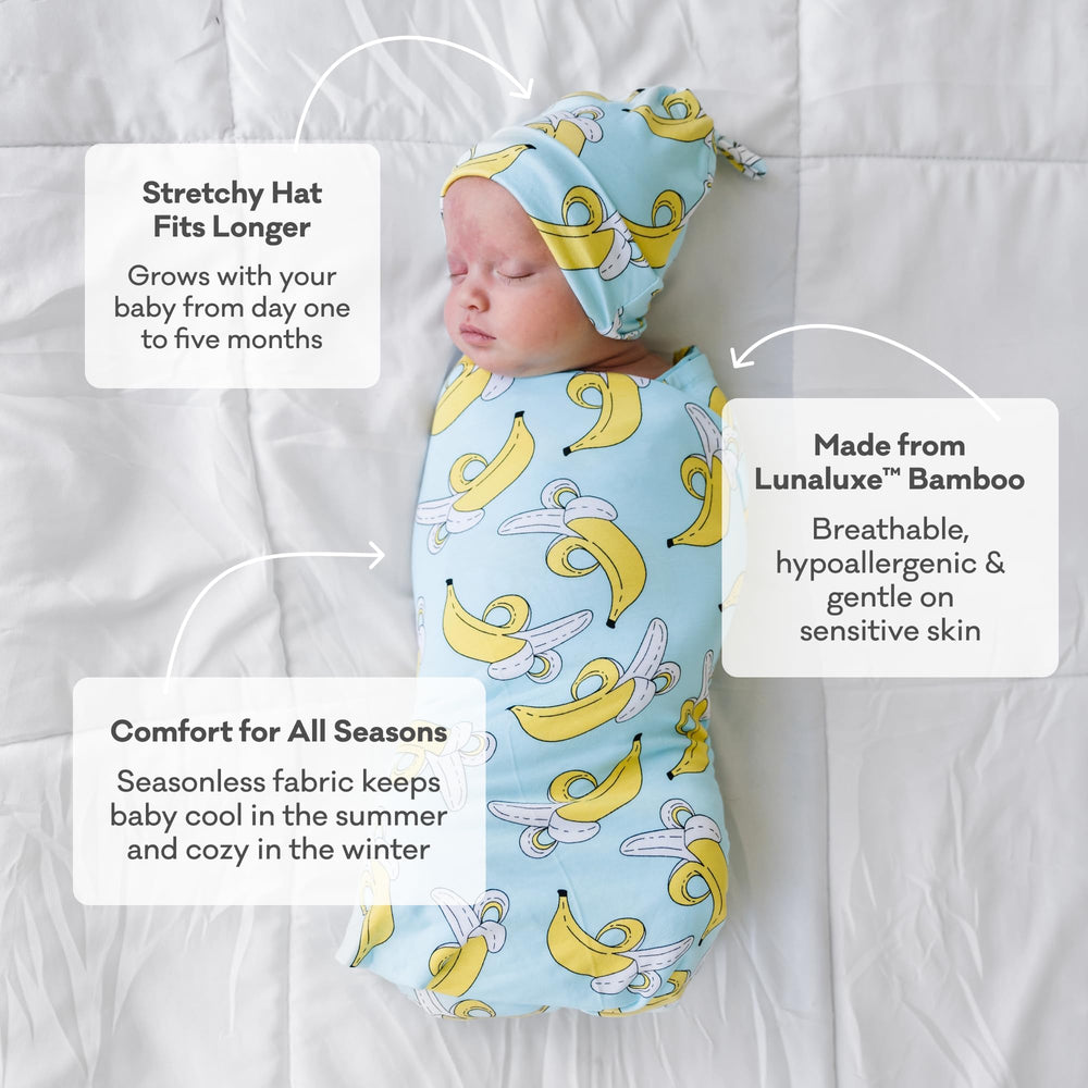 Little Sleepies Shark Soiree 44x44 swaddle demonstrates secure, stretchy wrap.