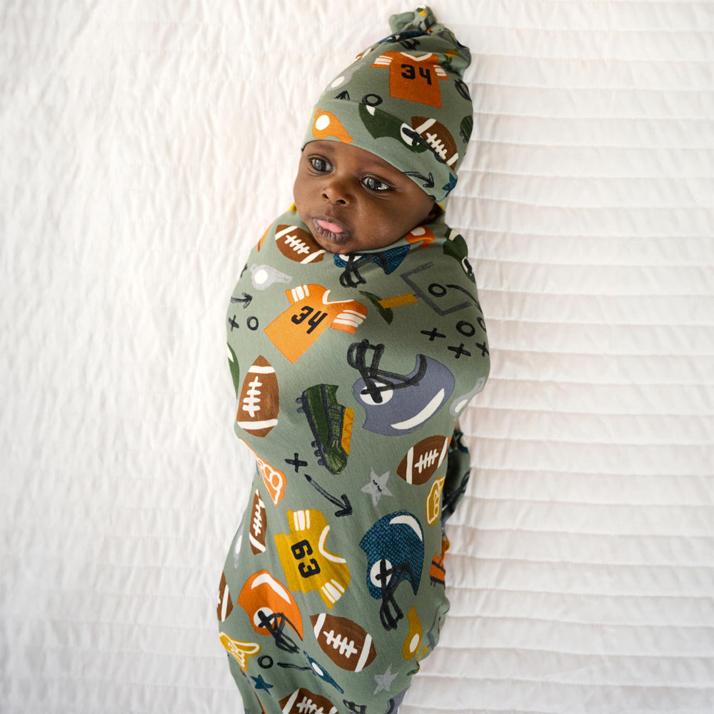 Little Sleepies 44x44 swaddle blanket spread for secure newborn wrapping.