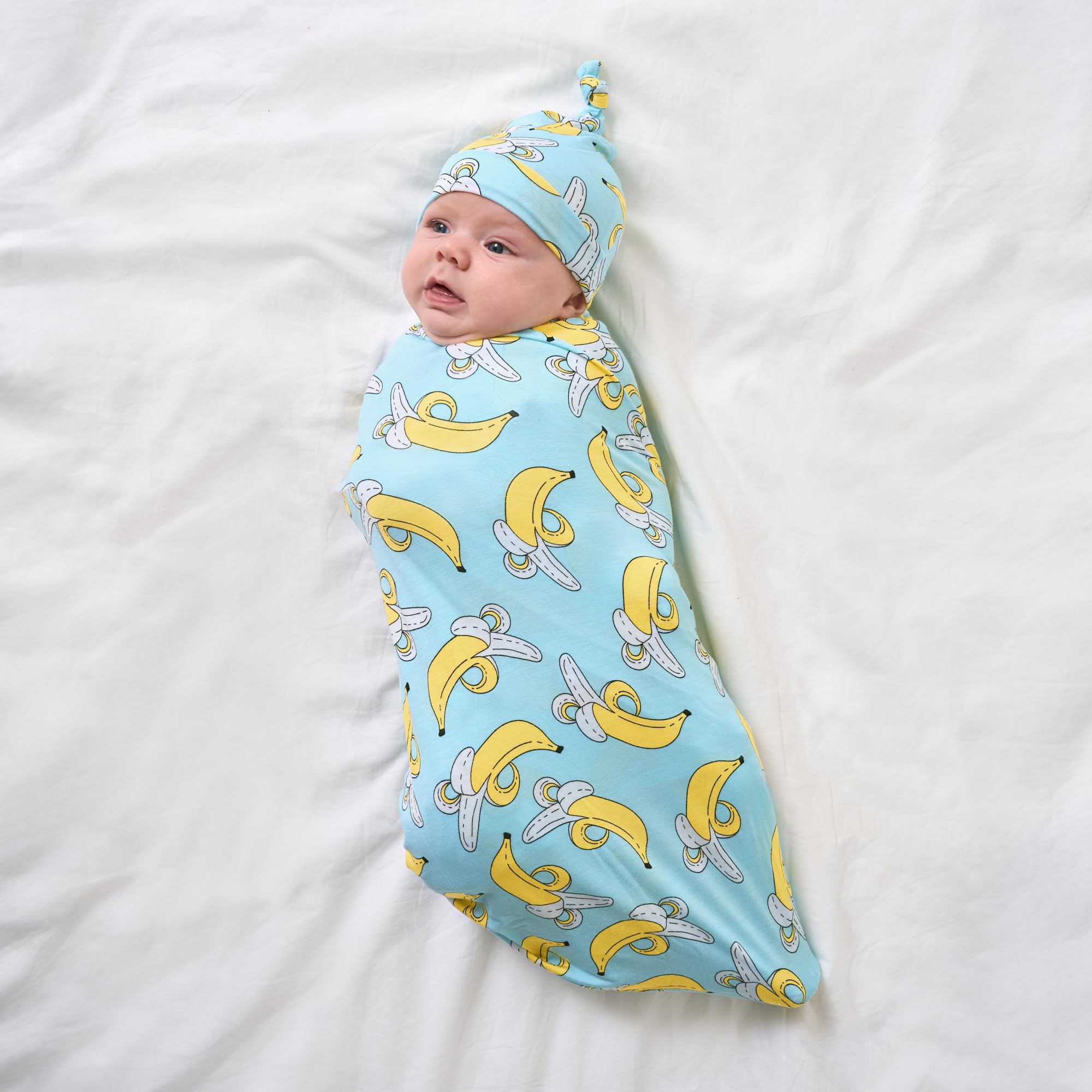 Little Sleepies banana-print swaddle serves as a soft playmat