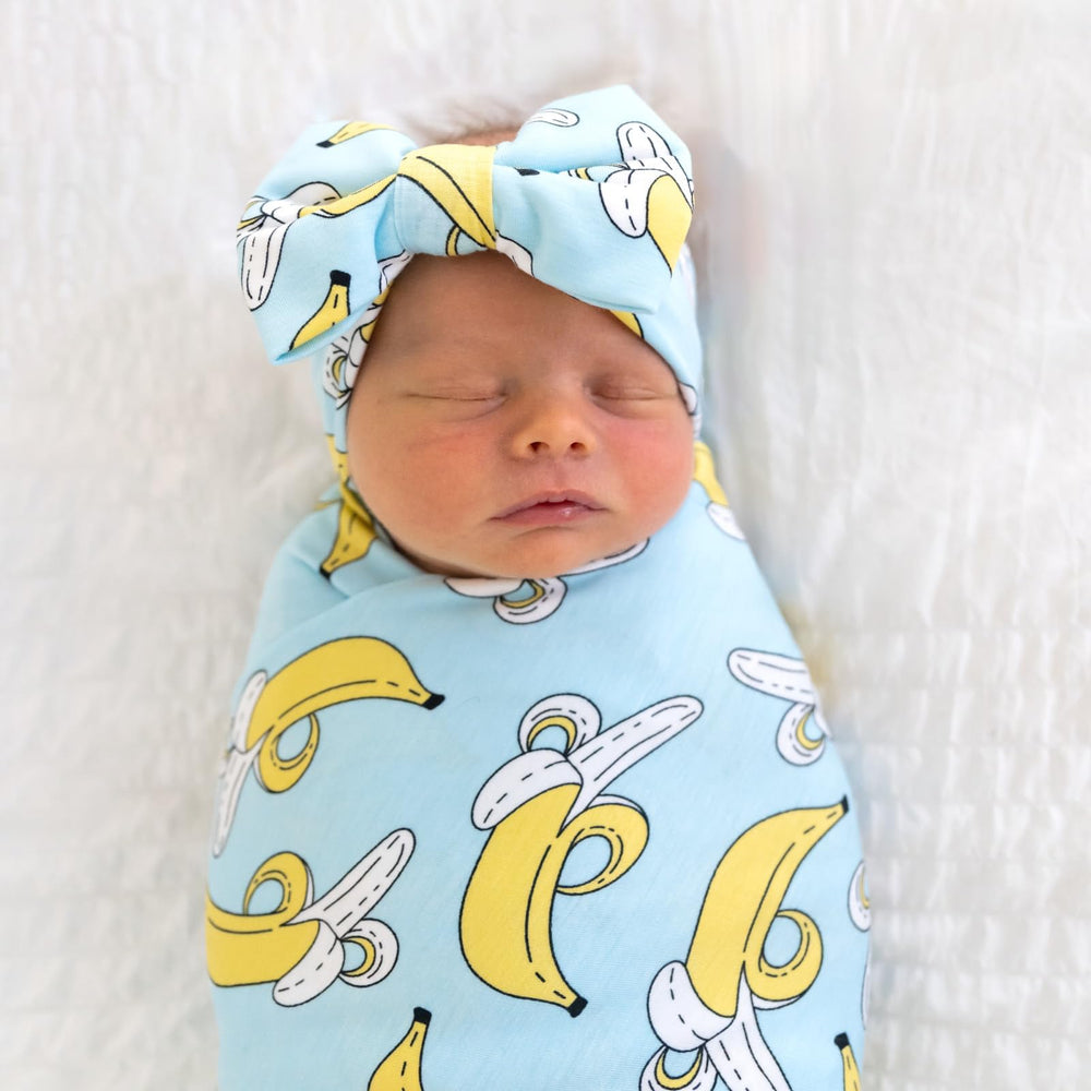 Little Sleepies swaddle-stroller-shade doubles as shade and cozy wrap.