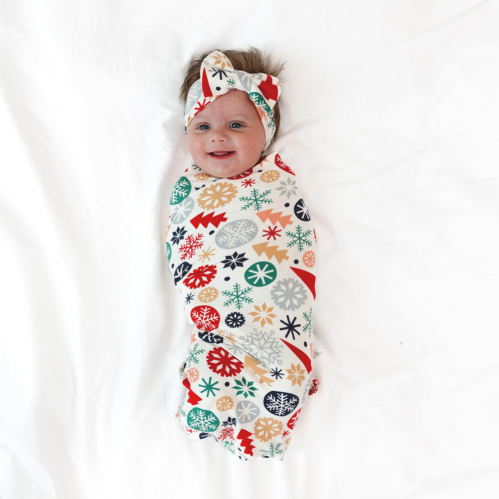 Little Sleepies swaddle close-up shows buttery-soft bamboo fabric and breathable weave.