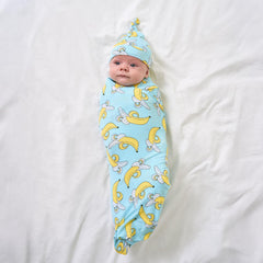 Little Sleepies swaddle used as stroller shade for sunny walks