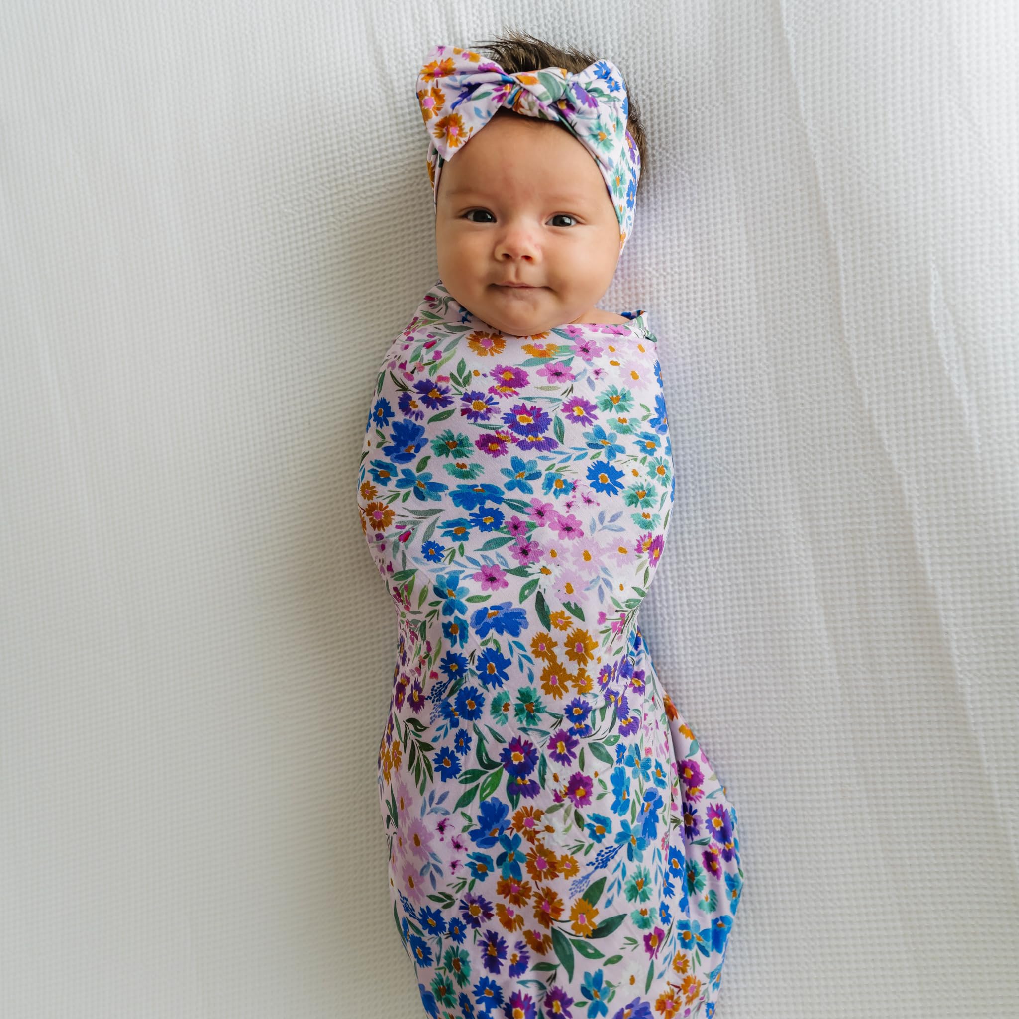 Baby wearing Luxe Bow Headband Sweet Pea for gentle, growing-fit styling