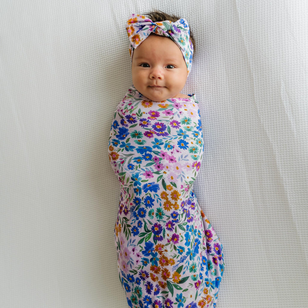 Baby wearing Luxe Bow Headband Sweet Pea for gentle, growing-fit styling