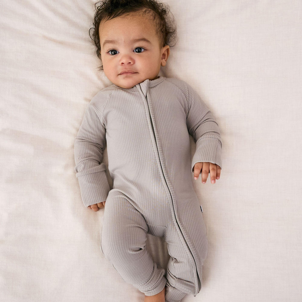 Little Sleepies two-way zip newborn sleeper for quick night diaper changes