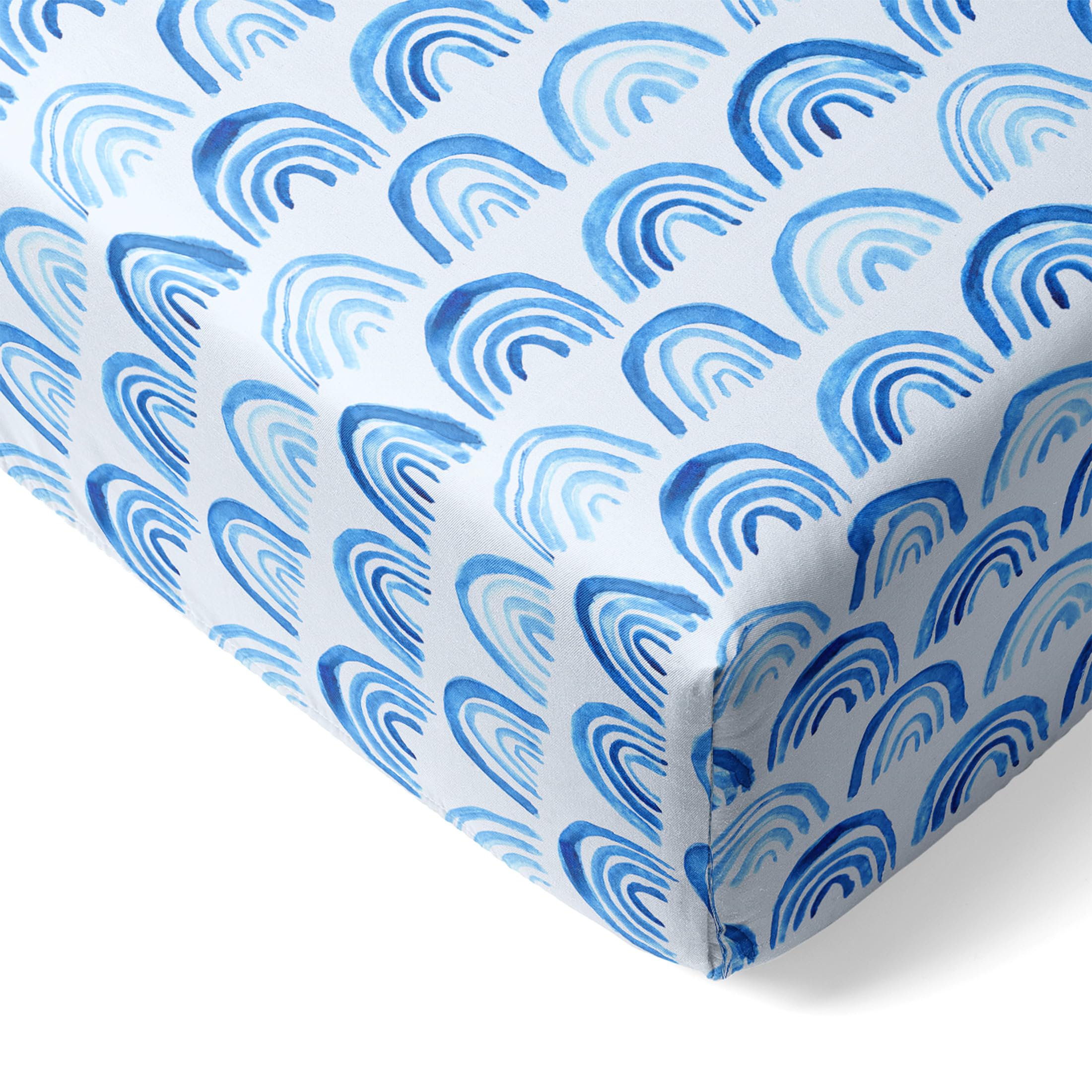Little Sleepies viscose bamboo crib sheets in blue rainbows offer ultra-soft comfort.