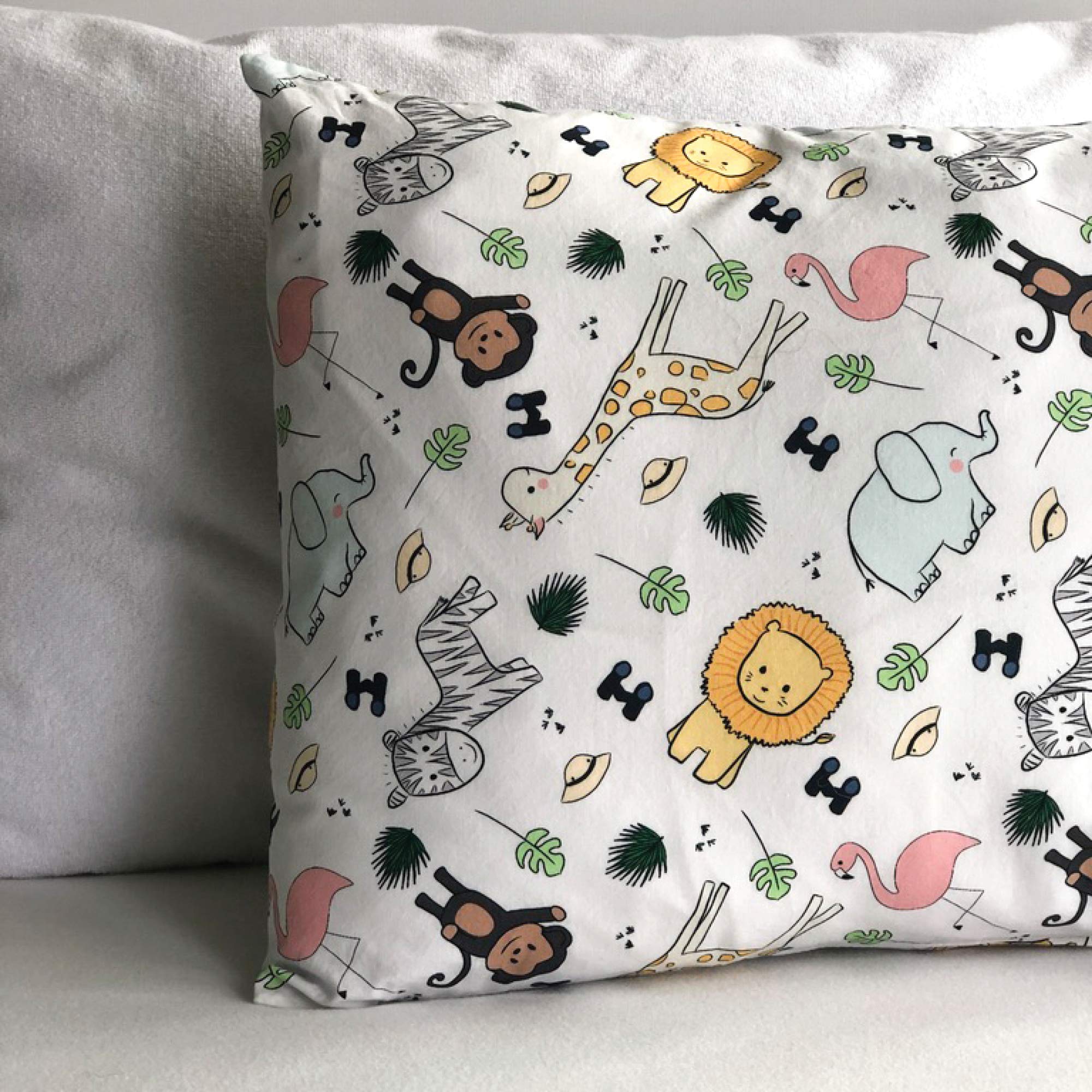 Safari design travel cover fits 16x22 pillows for kid-friendly trips.