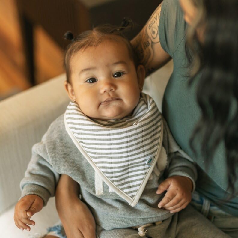 Little Unicorn Bib Planetary, worn by baby, teething-friendly drool protection.