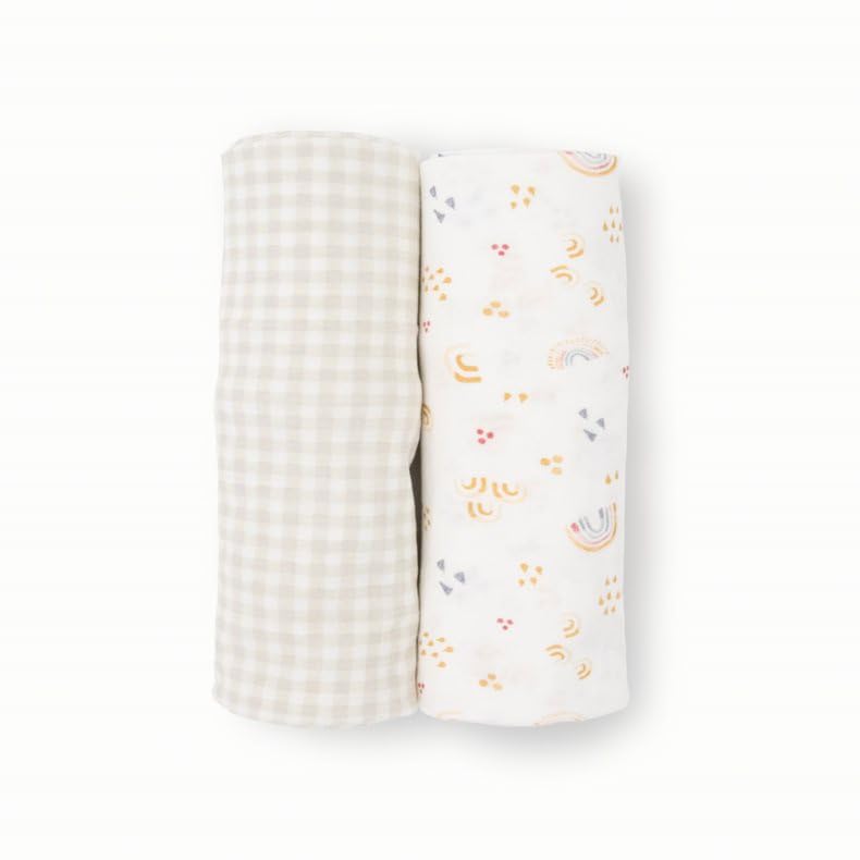 Little Unicorn baby resting peacefully in soft wrap highlights gentle security