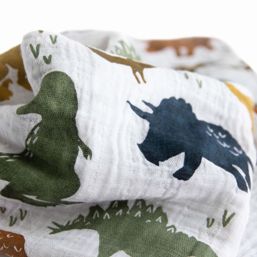 Little Unicorn breathable muslin fabric texture closeup highlights airy comfort for babywear.