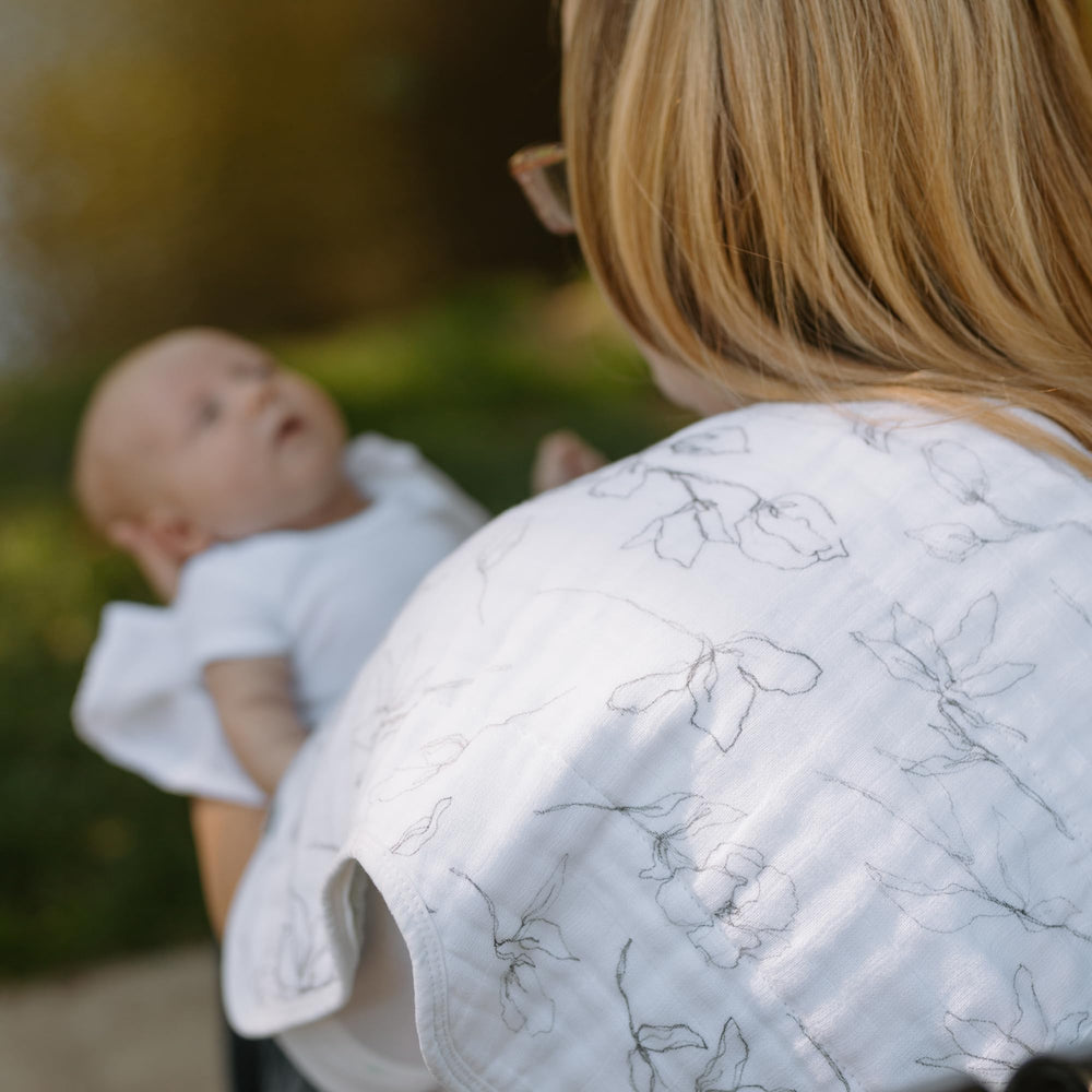 Little Unicorn pencil floral burp cloth close-up reveals multi-layer muslin texture.