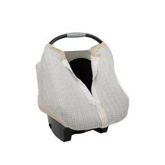 Little Unicorn car seat canopy showing magnetic closure for secure checks.