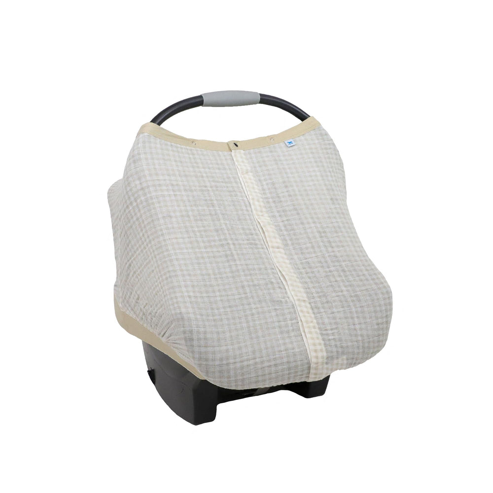 Little Unicorn car seat canopy with peek-a-boo window for private checks.