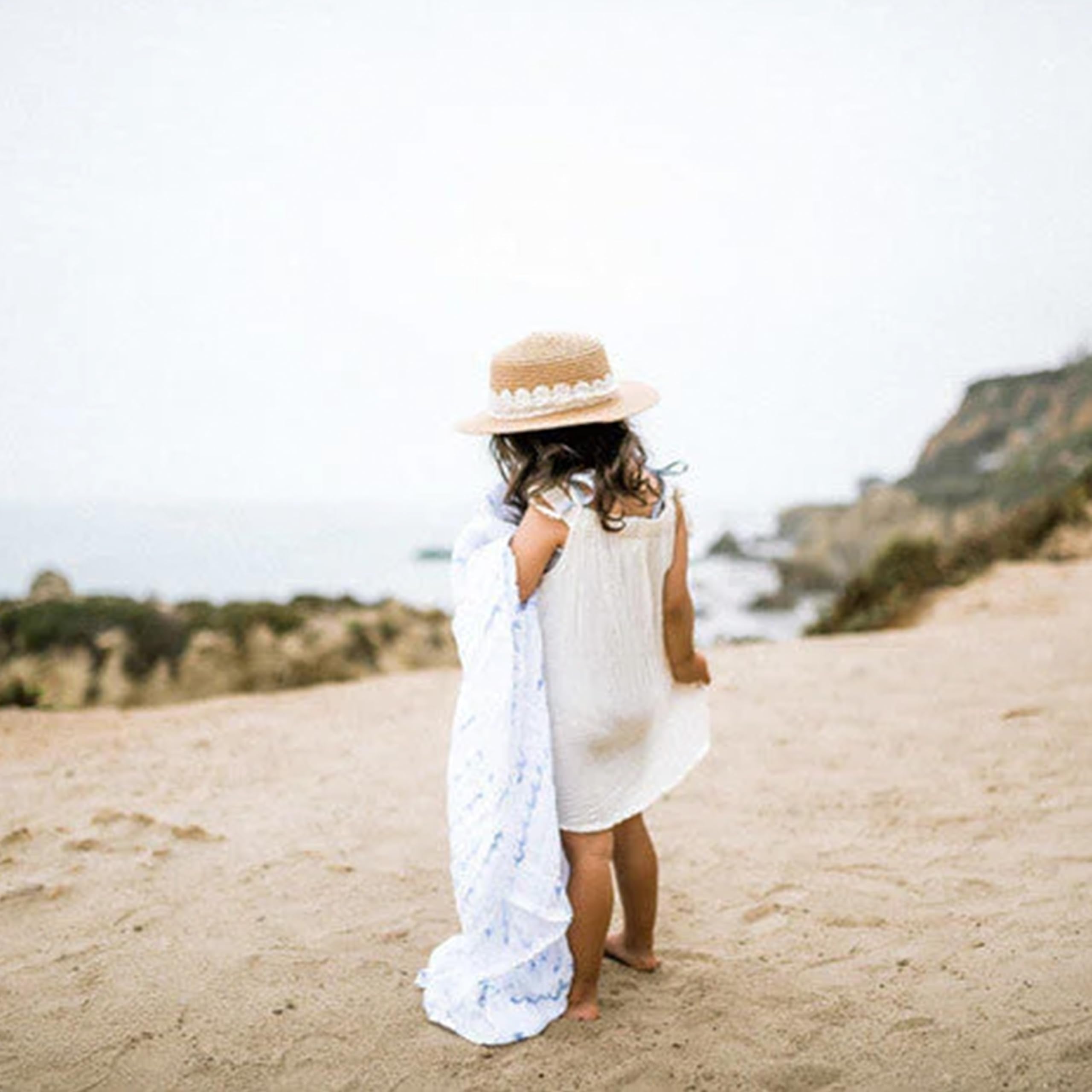Little Unicorn car-seat wrap swaddle provides lightweight protection during rides.