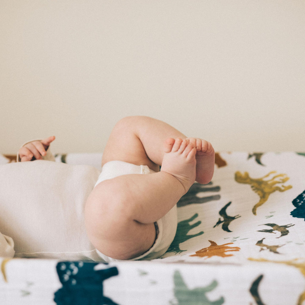 Little Unicorn Dino Friends cover features elastic edges for a snug, safe fit