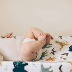 Little Unicorn Dino Friends cover features elastic edges for a snug, safe fit