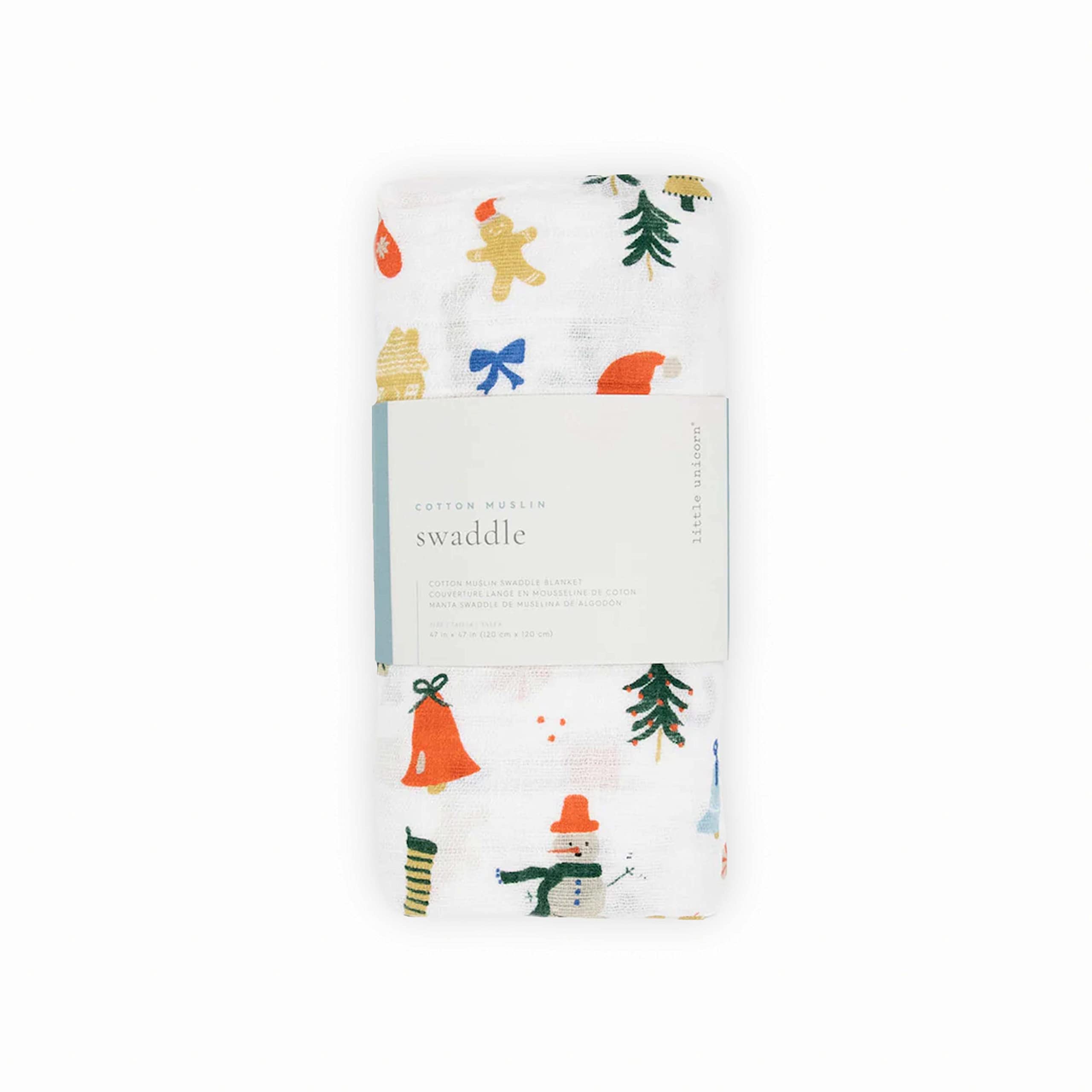 Little Unicorn Christmas Time swaddle spread as play mat during tummy time.