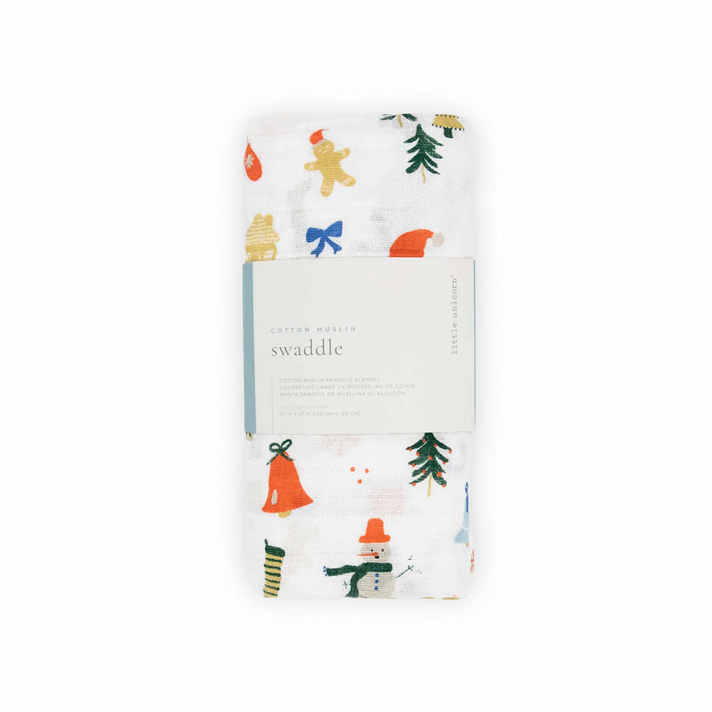 Little Unicorn Christmas Time swaddle spread as play mat during tummy time.
