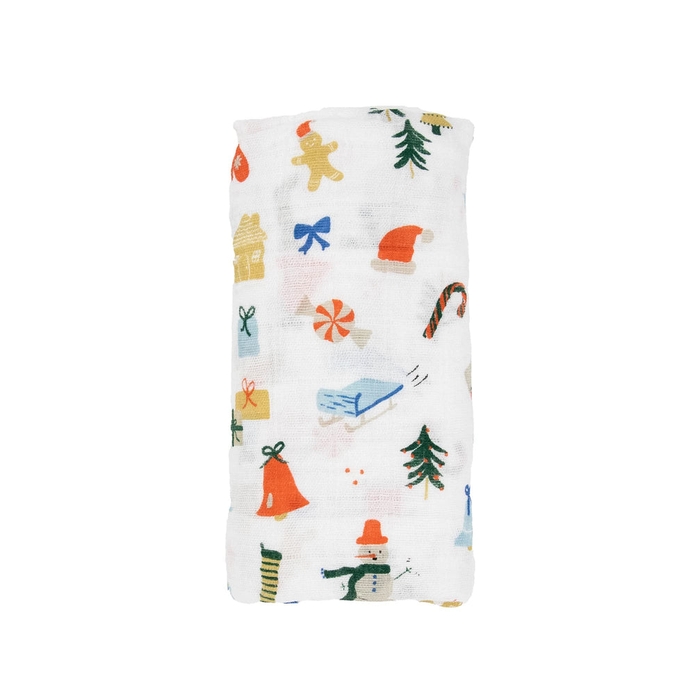 Little Unicorn Christmas Time swaddle used as stroller cover for on-the-go comfort.