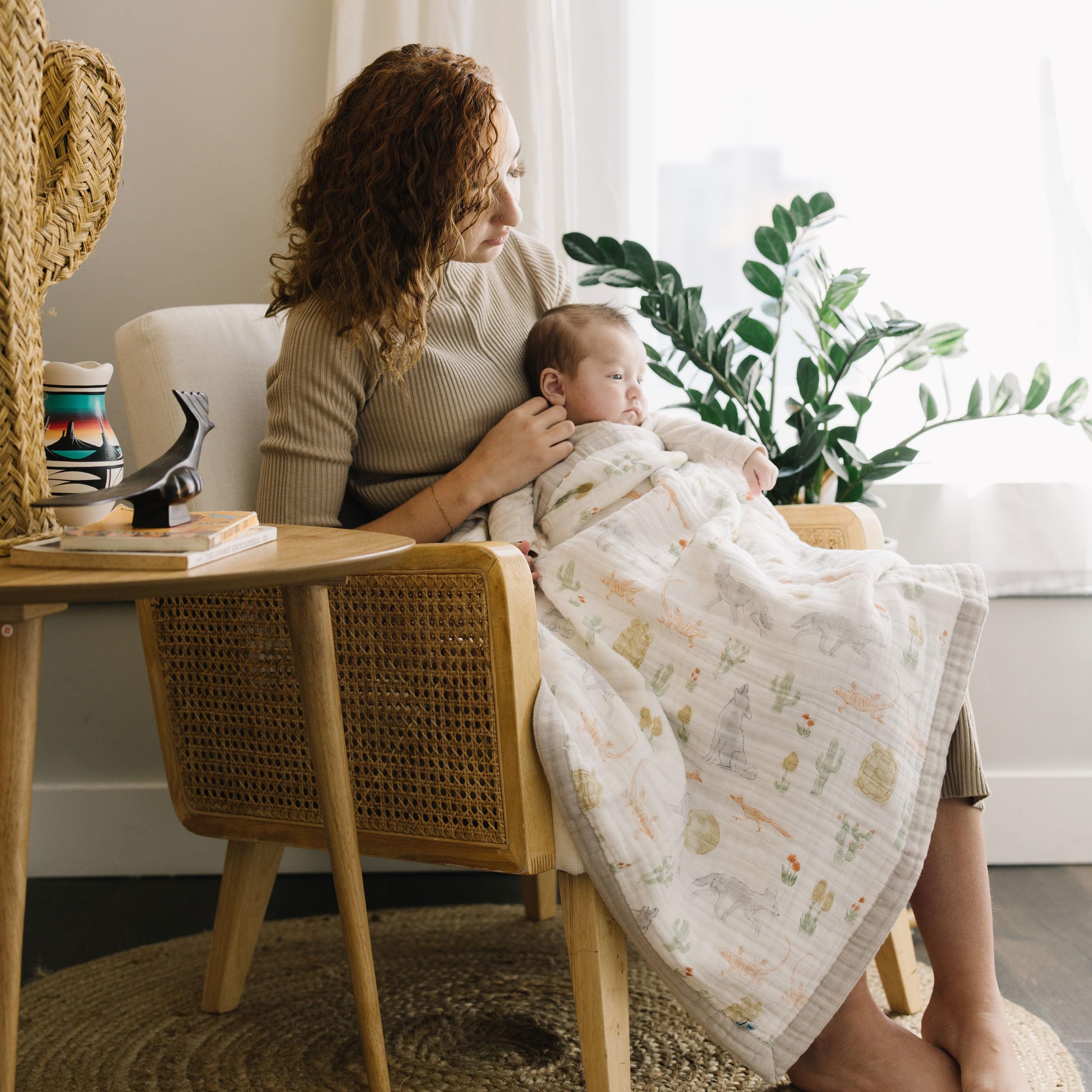 Little Unicorn Desert Night car-seat wrap provides secure, breathable warmth for travel.