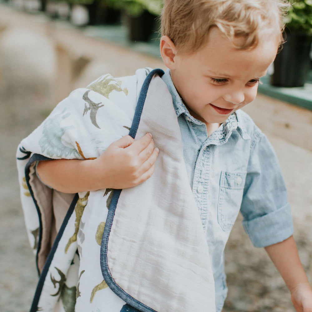 Quilt used as stroller cover provides lightweight warmth and privacy.