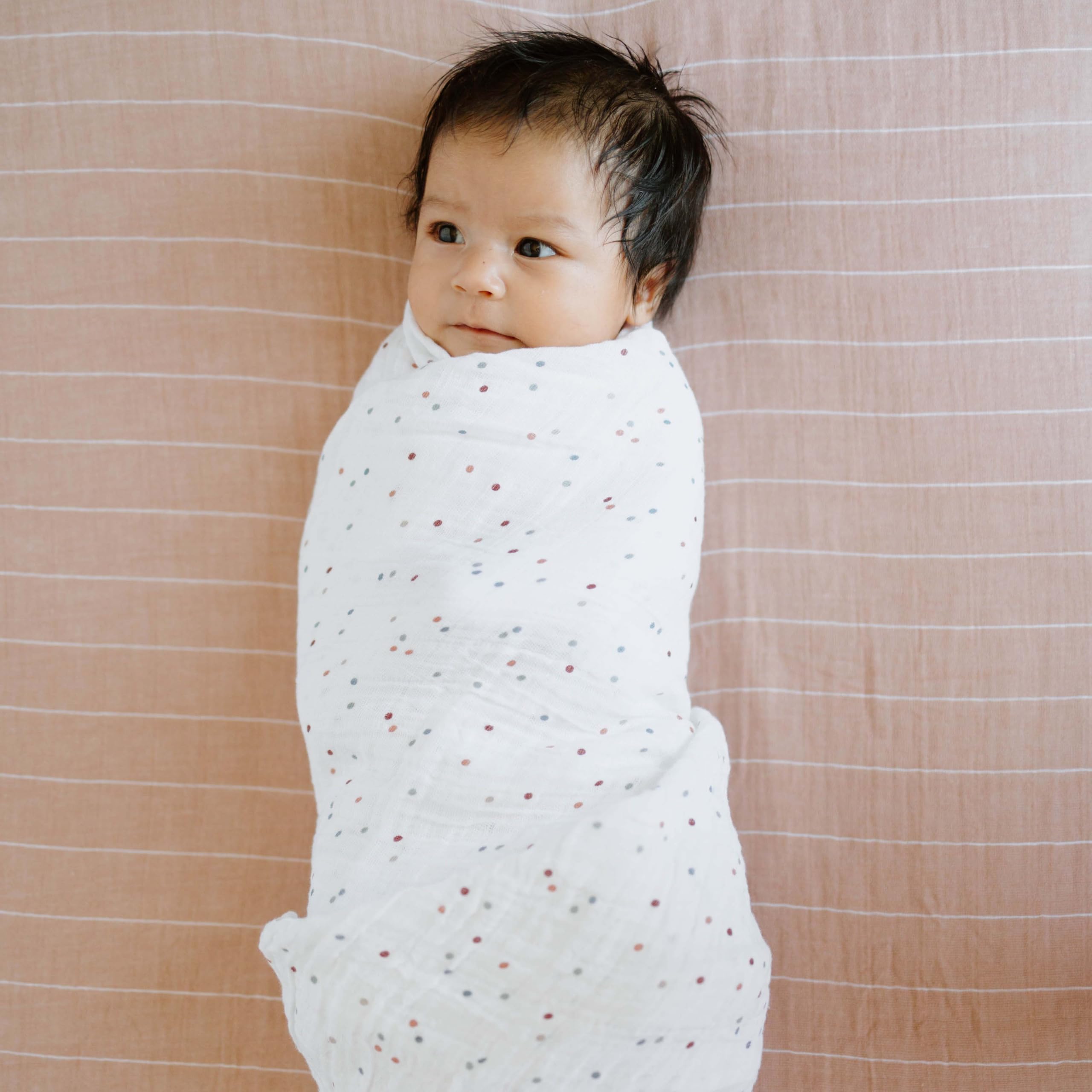 Little Unicorn dots swaddle ample size supports easy swaddling and nursing