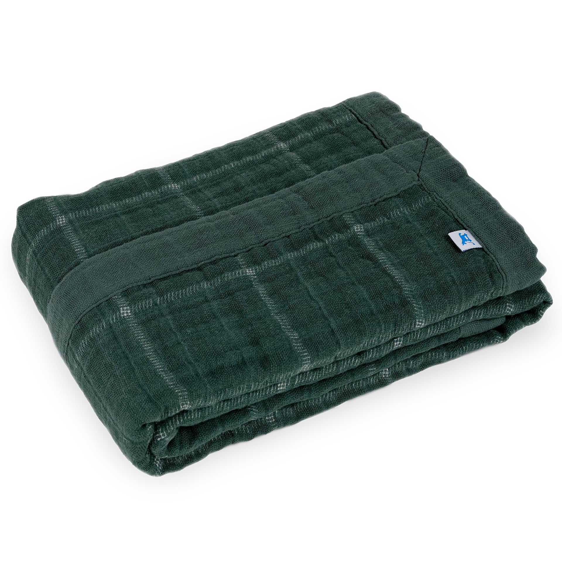 Little Unicorn Evergreen plaid muslin quilt used as a playtime blanket, soft and breathable