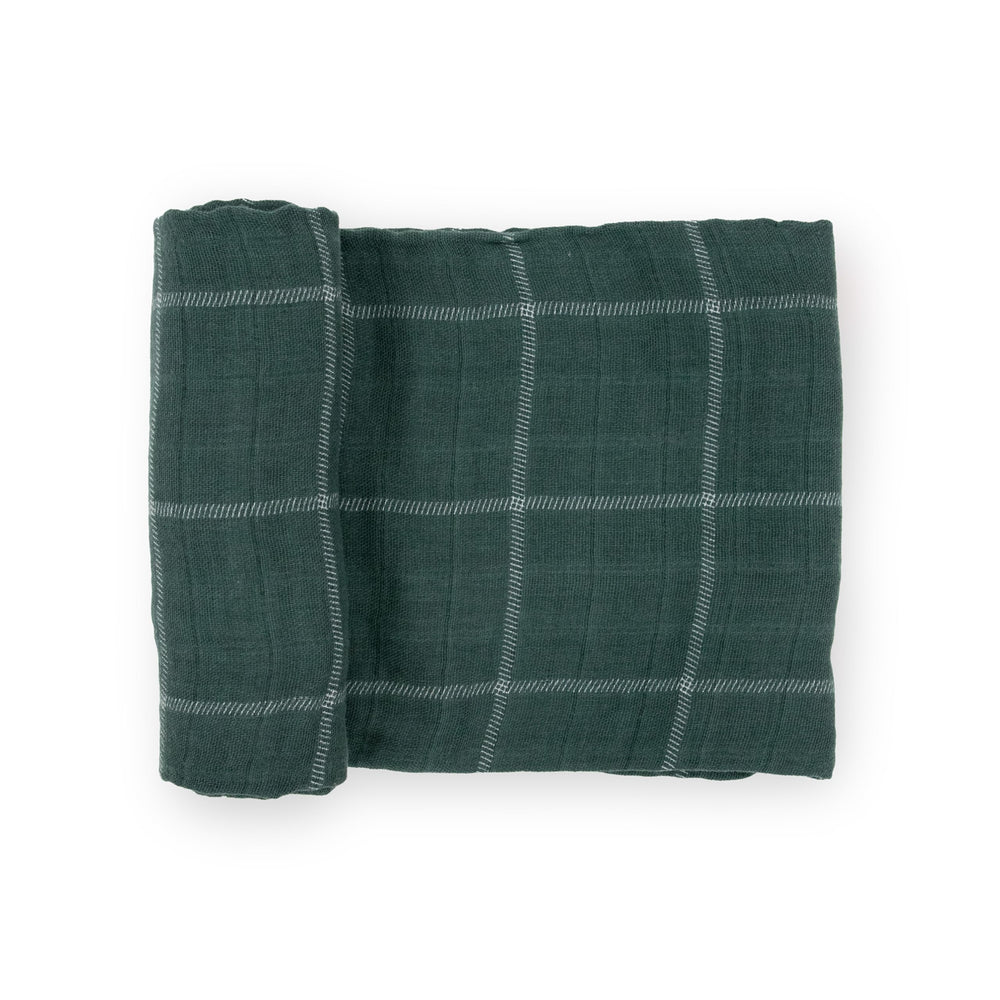 Little Unicorn evergreen plaid swaddle blanket showing breathable cotton softness for baby comfort.
